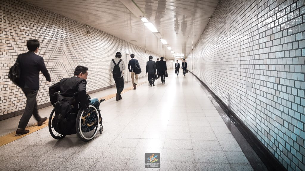 Saba is wheeling along the subway walking path